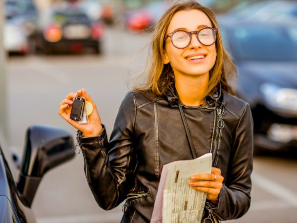 Woman with a Rental Car at the Airport